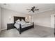 Elegant main bedroom with carpeted floors, decorative lighting, and tray ceilings at 216 Ocean Jasper Dr, Holly Springs, NC 27540