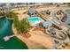 Aerial view showcases community pool, playground, clubhouse, lake pier, and surrounding neighborhood at 217 Douglas Falls Dr, Wendell, NC 27591
