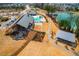 Aerial view of community amenities including pool, lake, clubhouse, playground, and walking paths at 217 Douglas Falls Dr, Wendell, NC 27591