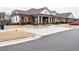 Brick clubhouse featuring a parking lot with handicap spaces and green spaces at 2456 Tonoloway Dr, Raleigh, NC 27610