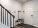 Inviting entryway featuring hardwood floors, neutral paint, and convenient shoe rack at 2456 Tonoloway Dr, Raleigh, NC 27610