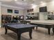 Entertaining game room with ping pong, pool table, arcade games, and a TV for a complete entertainment experience at 2456 Tonoloway Dr, Raleigh, NC 27610