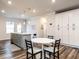 Charming eat-in kitchen with grey cabinets, ample counter space, and hardwood floors at 2456 Tonoloway Dr, Raleigh, NC 27610