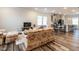 Inviting living room with hardwood floors flowing into the kitchen with a breakfast bar at 2456 Tonoloway Dr, Raleigh, NC 27610
