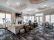 Inviting living room featuring a fireplace, large windows, modern decor, and stylish furniture at 2456 Tonoloway Dr, Raleigh, NC 27610
