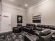 Cozy media room with comfortable seating, a large screen, and dim lighting for an immersive movie experience at 2456 Tonoloway Dr, Raleigh, NC 27610
