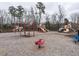 Community playground with swings, slides, spring rider and play structures for outdoor fun and recreation at 2456 Tonoloway Dr, Raleigh, NC 27610