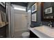 Modern bathroom with white tile, a vanity with a vessel sink, and stylish fixtures at 247 Gilliland Rd, Siler City, NC 27344