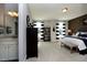 Bright bedroom with striped curtains, carpet flooring, and an en-suite bathroom, beautifully designed at 247 Gilliland Rd, Siler City, NC 27344