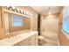 Bathroom featuring a double vanity, updated fixtures, and tub with shower at 2704 Pidgeon Hill Rd, Raleigh, NC 27613