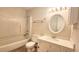 Cozy bathroom featuring a shower-tub combination, a neutral color palette, and a bright vanity area at 2704 Pidgeon Hill Rd, Raleigh, NC 27613