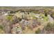 Aerial view showing property with sheds, garage, pool, and play set on a large lot at 2746 Moss Creek Loop, Elon, NC 27244