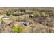 Aerial shot of the home with a private drive and secluded location nestled among the trees at 2746 Moss Creek Loop, Elon, NC 27244