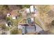 Aerial view showcases the property layout, including the house, yard, pool, outbuildings, and driveway at 2746 Moss Creek Loop, Elon, NC 27244