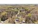 Aerial view showing home nestled in a wooded area with a long private driveway at 2746 Moss Creek Loop, Elon, NC 27244