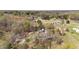 Aerial view of property showcasing location in a wooded neighborhood at 2746 Moss Creek Loop, Elon, NC 27244