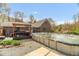 View of the backyard featuring an above-ground pool, wooden deck with gazebo, and well-maintained lawn at 2746 Moss Creek Loop, Elon, NC 27244