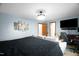 Bedroom featuring modern decor, a ceiling fan and a wall-mounted television at 2746 Moss Creek Loop, Elon, NC 27244