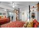 Cozy bedroom with a mirrored closet and decorative shelves at 2746 Moss Creek Loop, Elon, NC 27244