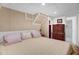 Comfortable bedroom with white bedframe and a dresser, creating a functional and restful space at 2746 Moss Creek Loop, Elon, NC 27244
