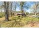 Home nestled among trees, showcasing spacious yard and peaceful, private setting at 2746 Moss Creek Loop, Elon, NC 27244