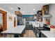 Contemporary kitchen featuring a large island, stainless steel appliances, and modern lighting at 2746 Moss Creek Loop, Elon, NC 27244
