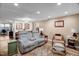 Relaxing living room with comfortable seating, decorative rug, and side tables offering a cozy atmosphere at 2746 Moss Creek Loop, Elon, NC 27244