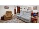 Comfortable seating with a plush loveseat and recliner, complemented by a decorative rug and side tables at 2746 Moss Creek Loop, Elon, NC 27244