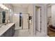 Modern bathroom featuring a sleek glass shower with white and black herringbone tile at 285 Gilliland Rd, Siler City, NC 27344