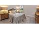 Comfortable bedroom with plush carpeting, neutral decor, and ample natural light from the window at 285 Gilliland Rd, Siler City, NC 27344