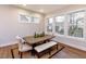 Bright dining room featuring modern windows, neutral colors, and simple decor at 285 Gilliland Rd, Siler City, NC 27344
