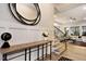 Elegant entryway featuring wood floors, decorative mirror, and views into the living space at 285 Gilliland Rd, Siler City, NC 27344