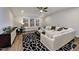 Bright and airy living room with large windows, white sofas, and a striking geometric rug at 285 Gilliland Rd, Siler City, NC 27344