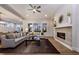 Spacious living room with fireplace, neutral colors, large windows, and modern decor at 285 Gilliland Rd, Siler City, NC 27344