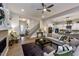 Open-concept living room with wood floors, fireplace, and seamless flow to the kitchen at 285 Gilliland Rd, Siler City, NC 27344