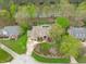 Aerial view of a home showcasing lush landscaping, a pool, and a prime location near a tranquil river at 2922 Bells Pointe Ct, Apex, NC 27539