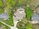 Overhead shot of a home highlighting the backyard pool, patio, detailed landscaping, and proximity to neighboring homes at 2922 Bells Pointe Ct, Apex, NC 27539