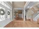 Stately foyer boasts hardwood floors, elegant staircase, transom windows, and views of the dining room at 2922 Bells Pointe Ct, Apex, NC 27539