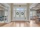 Elegant foyer showcasing detailed woodwork, gleaming hardwood floors, and views of the formal living and dining areas at 2922 Bells Pointe Ct, Apex, NC 27539