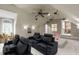 Spacious home theater with reclining chairs, ceiling fan, movie projector, and whimsical decor for  at 2922 Bells Pointe Ct, Apex, NC 27539