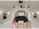 Bright and airy home theater featuring a large screen, comfortable seating, and whimsical ' furniture at 2922 Bells Pointe Ct, Apex, NC 27539