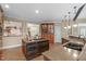 Kitchen with island cooktop, granite counters, hardwood floors, and lots of cabinet space at 2922 Bells Pointe Ct, Apex, NC 27539