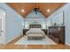 A tranquil main bedroom featuring hardwood floors, a wood-paneled ceiling, and large dressers at 2922 Bells Pointe Ct, Apex, NC 27539