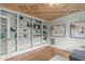 Stylish office featuring a custom ceiling, hardwood floors, and built-in shelving, perfect for working from home at 2922 Bells Pointe Ct, Apex, NC 27539