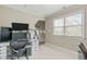 Neutral-colored office space with lots of light from the window with white blinds at 2922 Bells Pointe Ct, Apex, NC 27539