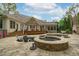 Custom in-ground pool and hot tub with a stone patio and a spacious deck, perfect for outdoor entertaining at 2922 Bells Pointe Ct, Apex, NC 27539