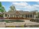 Beautiful in-ground pool with stone surround and wood deck, perfect for relaxing outdoors at 2922 Bells Pointe Ct, Apex, NC 27539