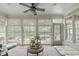 Sunroom with lots of natural light and outdoor views, featuring neutral colors and patterned rug at 2922 Bells Pointe Ct, Apex, NC 27539