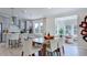 Open-concept dining area adjacent to the kitchen and living room, ideal for entertaining at 300 Seagraves Creek Ln, Holly Springs, NC 27540