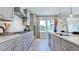 Modern kitchen featuring stainless steel appliances, ample counter space and a breakfast bar at 300 Seagraves Creek Ln, Holly Springs, NC 27540